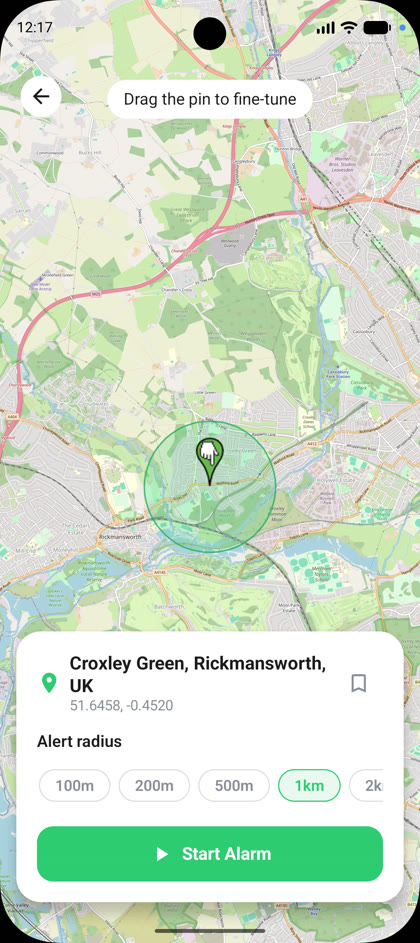 RouteWake map screen with a dropped pin and alert circle